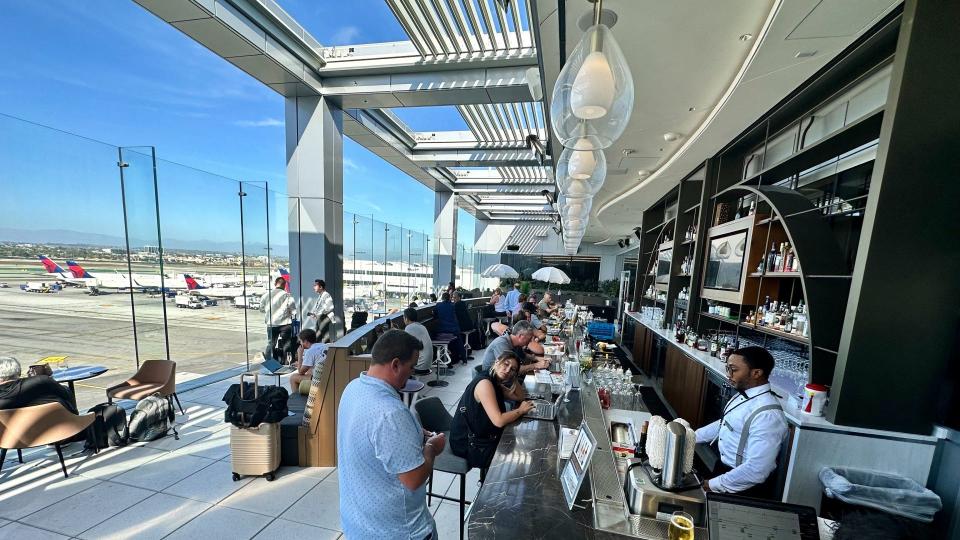 The highlight of the new LAX club is the Sky Deck all-weather outdoor terrace that offers complimentary cocktails and panoramic views of the flight line with downtown LA and the Hollywood Hills in the distance.