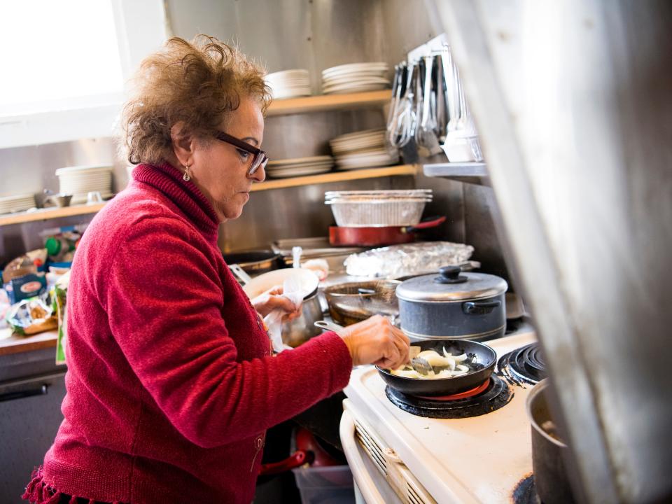 King Tut Grill owner Seham Girgis cooks a takeout order at her South Knoxville restaurant on Wednesday, February 13, 2019. Girgis said she may have to close the restaurant after KUB told her she needs a grease interceptor, which she says she cannot afford.