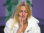 Defending champion Petra Kvitova of Czech Republic attends a news conference after losing her match against Serbia's Jelena Jankovic at the Wimbledon Tennis Championships in London, July 4, 2015. REUTERS/Javier Garcia/Pool