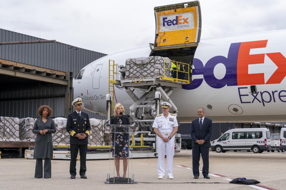 First lady Jill Biden, speaks next to U.S. Surgeon General Dr. Vivek Murthy, left, Vice Admiral Dee Mewbourne, Deputy Commander of the U.S. Transportation Command, and Tarun Malkani, President & CEO at Gerber, after a Fedex Express cargo plane carrying 100,000 pounds of baby formula arrived at Washington Dulles International Airport, Wednesday, May 25, 2022, in Chantilly, Va. (AP Photo/Jacquelyn Martin)