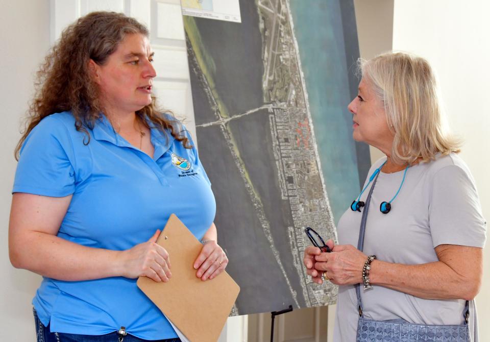 Nadine Brooks, with the Florida Department of Environmental Protection, talks with Carol Ruggiero of South Patrick Shores. The U.S. Army Corps of Engineers hosted a community meeting at Pelican Beach Club House in Satellite Beach. The February 16 event was to brief residents on the clean up plans for South Patrick Shores.
