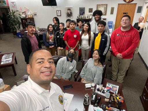 Passaic Mayor Hector Lora with the 13 students who attended first day of election working training on Wednesday at City Hall.