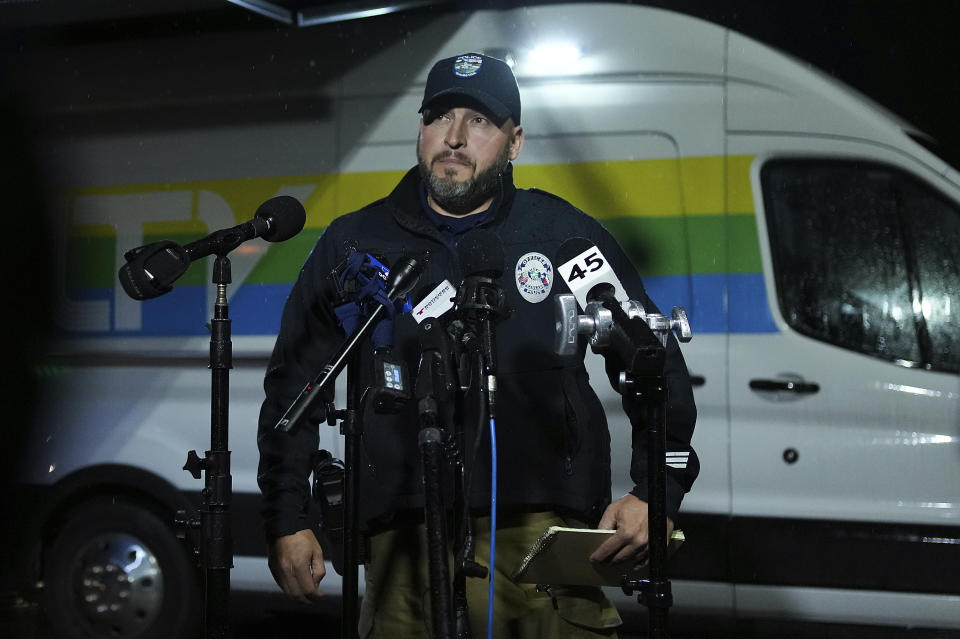 Chad Rogers, public informational officer for Pearland Police Department, gives a statement to the media after a shooting outside Cole's Antique Village and Flea Market, Sunday, Nov. 12, 2023, in Pearland, Texas, near Houston. (Elizabeth Conley/Houston Chronicle via AP)