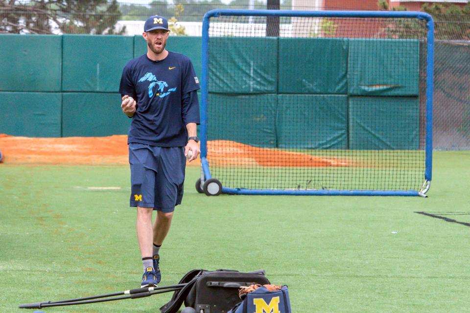 Jun 20, 2019; Omaha, NE, USA; Michigan pitching coach Chris Fetter looks on during team practice at Creighton on June 20, 2019.