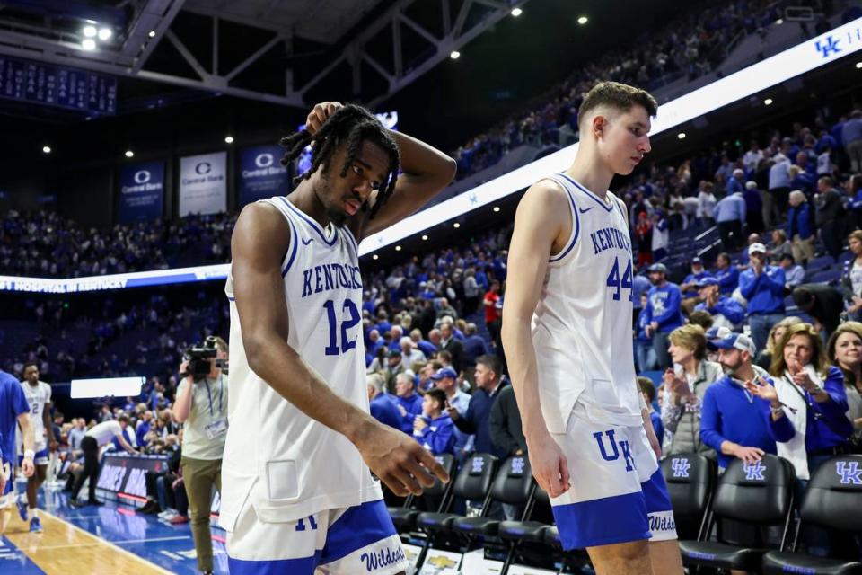 Kentucky players Antonio Reeves, left, and Zvonimir Ivisic leave the court after losing to Gonzaga on Saturday, the Wildcats’ third consecutive defeat in Rupp Arena, the first time that’s happened in the program’s history.