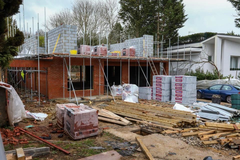 A new house is being built in the bungalows place