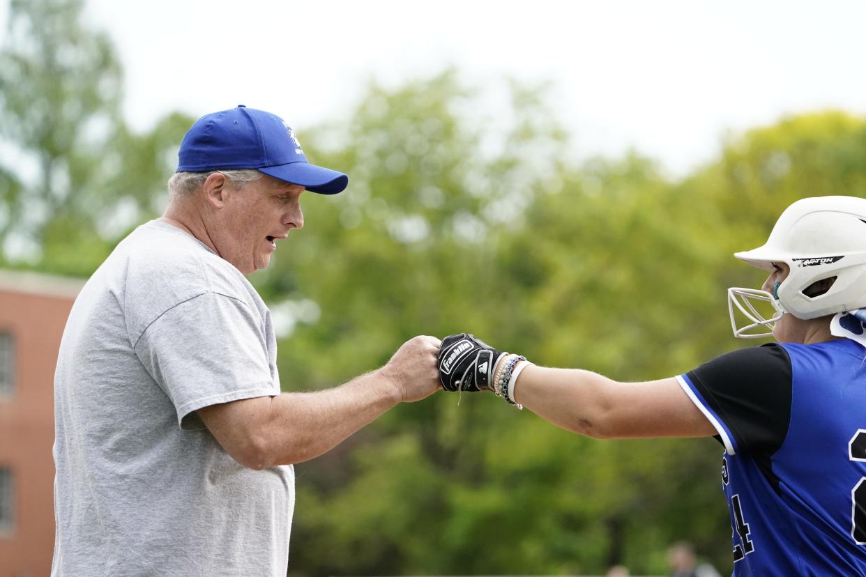 Passaic Tech softball head coach Mike Boorman fist-bumps Savannah Czornomor in the first inning. Passaic Valley softball hosts Passaic Tech on Tuesday, May 9, 2023, in Little Falls.