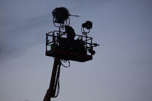 A film crew member works on a scene for the movie "Batman v. Superman: Dawn of Justice." The film received $35 million in incentives to shoot in Michigan under a now-shuttered incentives program, and now lawmakers want to introduce a new incentives program for film and other media projects in Michigan.