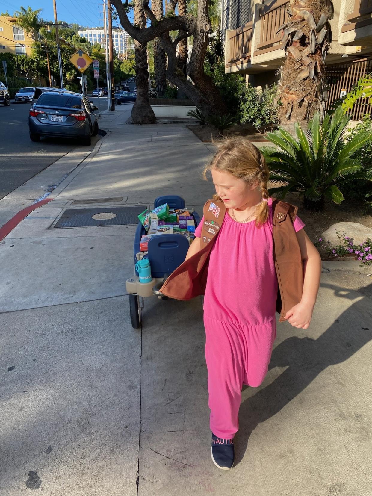 Girl Scout Siena Levin, 7, arriving to the LGBTQ neighborhood of West Hollywood, Calif., fully equipped with a wagon full of Girl Scout cookies. (Photo courtesy: Jen Levin) 