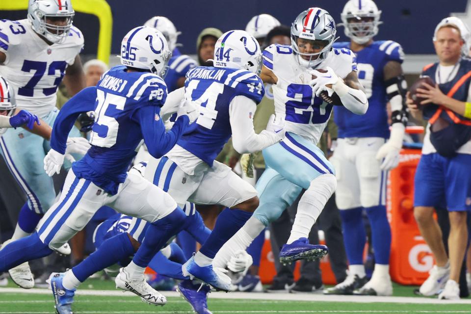 ARLINGTON, TEXAS - DECEMBER 04: Tony Pollard #20 of the Dallas Cowboys runs with the ball in the first half of a game against the Indianapolis Colts at AT&T Stadium on December 04, 2022 in Arlington, Texas.