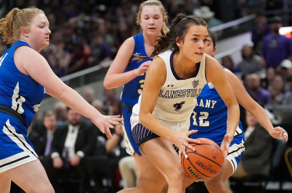 Lanesville Eagle Hadley Crosier (4) breaks between Bethany Christian defenders Saturday, Feb. 25, 2023, during the IHSAA Class A state championship game at Gainbridge Fieldhouse in Indianapolis. 