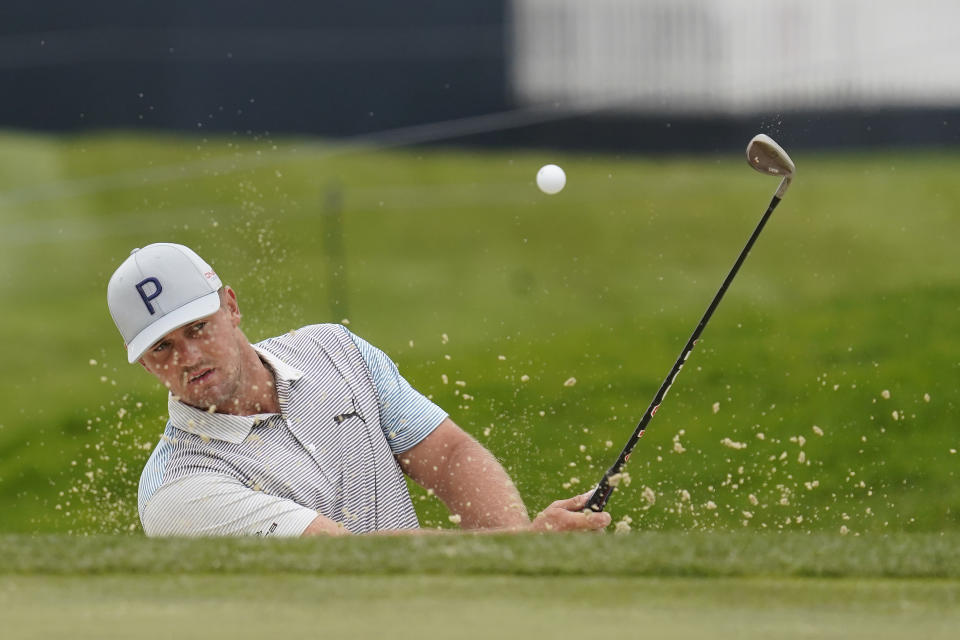Bryson DeChambeau hits from a bunker to the first green during practice for the PGA Championship golf tournament at TPC Harding Park in San Francisco, Tuesday, Aug. 4, 2020. (AP Photo/Jeff Chiu)