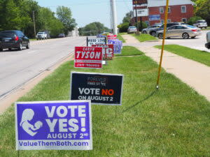 Signs for and against the state constitutional amendment became a common sight throughout Kansas over summer. Now that the vote is over, we can take a step back. (Tim Carpenter/Kansas Reflector)