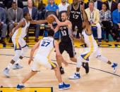 May 14, 2017; Oakland, CA, USA; San Antonio Spurs guard Manu Ginobili (20) controls the ball between Golden State Warriors forward Kevin Durant (35), center Zaza Pachulia (27) and forward Andre Iguodala (9) during the second quarter in game one of the Western conference finals of the 2017 NBA Playoffs at Oracle Arena. Mandatory Credit: Kelley L Cox-USA TODAY Sports