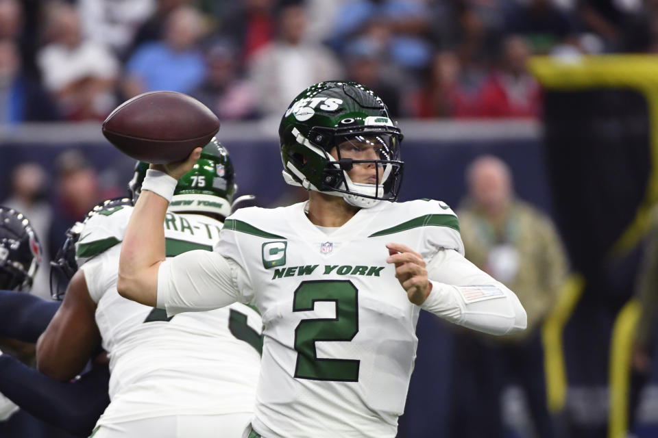 New York Jets quarterback Zach Wilson (2) passes in the first half of an NFL football game against the Houston Texans in Houston, Sunday, Nov. 28, 2021. (AP Photo/Justin Rex)