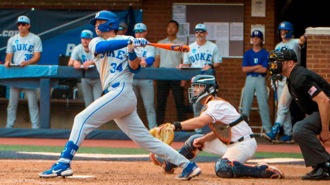 Duke’s Luke Storm hits an RBI single in the eighth inning during an NCAA college baseball super regional game against Virginia, Friday, June 9, 2023 in Charlottesville.