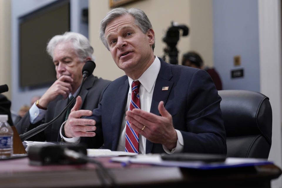 FBI Director Christopher Wray, joined by Central Intelligence Agency Director William Burns, testifies during the House Select Committee on Intelligence annual open hearing on worldwide threats at the Capitol in Washington, Thursday, March 9, 2023. (AP Photo/Carolyn Kaster)