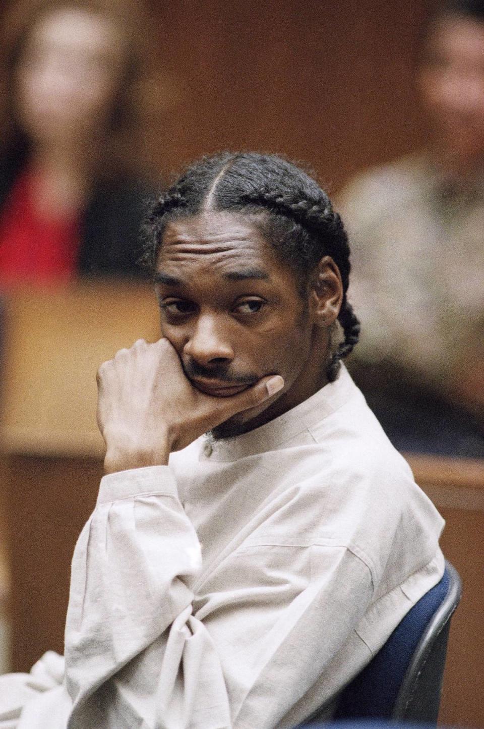 Rapper Snoop Doggy Dog, whose real name is Calvin Broadus, sits in a Los Angeles courtroom, May 19, 1995 during a hearing in his murder case. Broadus and two others are accused in a drive-by killing. (AP Photo/Nick Ut/Pool)