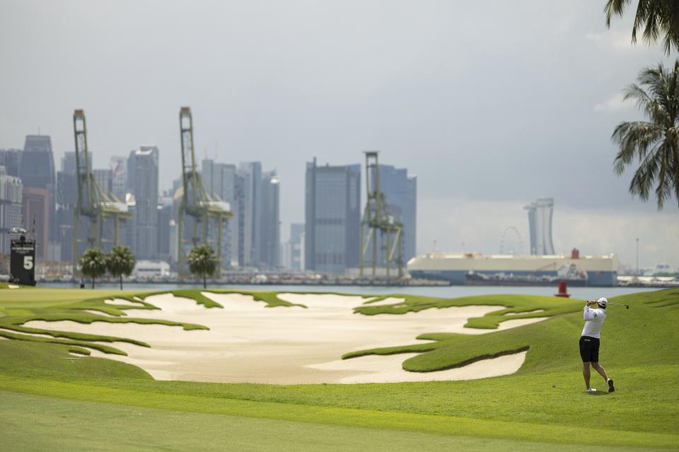 Peter Uihlein of 4Aces GC hits his shot from the fairway on the fifth hole during the first round of LIV Golf Singapore at the Sentosa Golf Club on Friday, April 28, 2023 in Sentosa, Singapore. (Doug DeFelice/LIV Golf via AP)