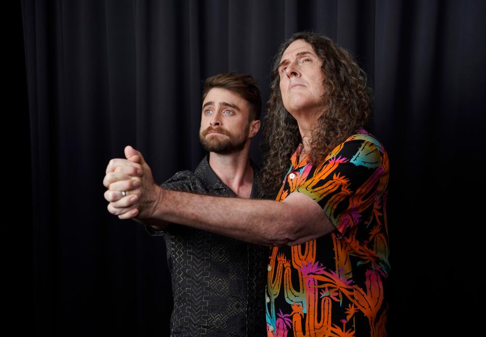 Daniel Radcliffe (left) and "Weird Al" Yankovic strike a pose for a portrait at the Bisha Hotel during the Toronto International Film Festival.