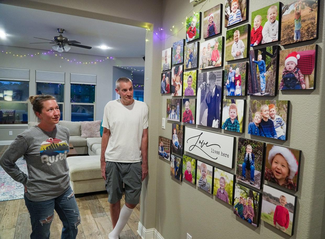 Cristi and Al Peterson reminisce as they look at family photos at their home. Cristi calls him her "superman. ... If anybody was going to survive this, it would be him."