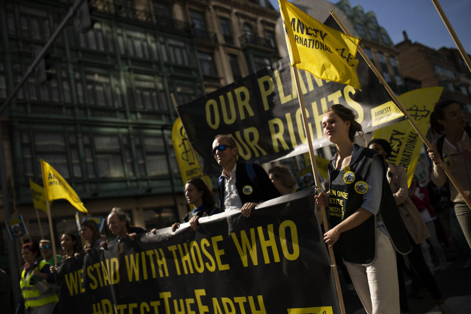 Thousands march during a climate protest in Brussels, Friday, Sept. 20, 2019. In Canberra and Kabul, Cape Town and Berlin, and across the globe, hundreds of thousands of people took the streets Friday to demand that leaders tackle climate change in the run-up to a U.N. summit. (AP Photo/Francisco Seco)