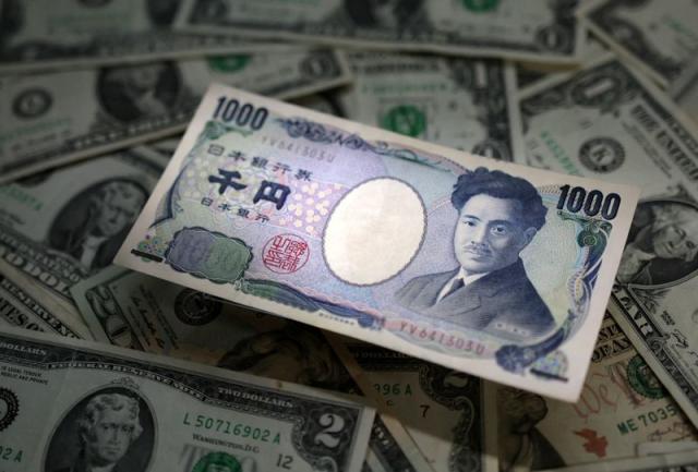 FILE PHOTO: Illustration shows Japanese Yen and U.S. dollar banknotes