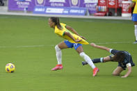 Brazil midfielder Adriana, left, is grabbed by Argentina midfielder Vanesa Santana during the second half of a SheBelieves Cup women's soccer match, Thursday, Feb. 18, 2021, in Orlando, Fla. (AP Photo/Phelan M. Ebenhack)