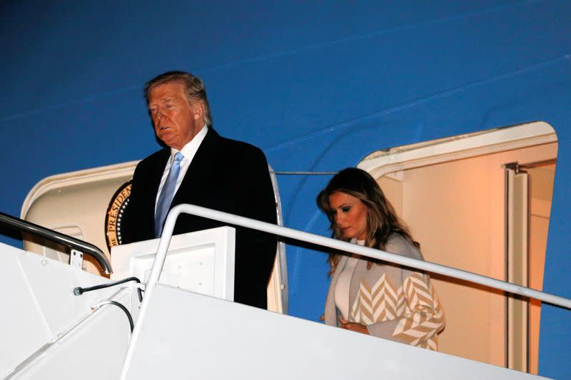 U.S. President Donald Trump and first lady Melania Trump descend from Air Force One at Joint Base Andrews, Maryland