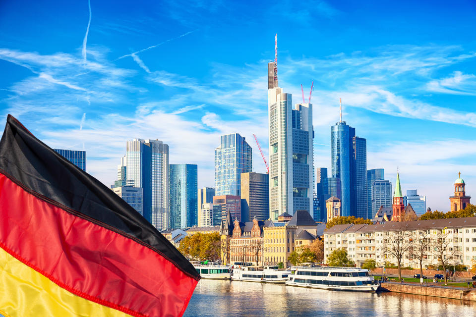 bitcoin Skyline cityscape of Frankfurt, Germany during sunny day with german flag. Frankfurt Main in a financial capital of Europe
