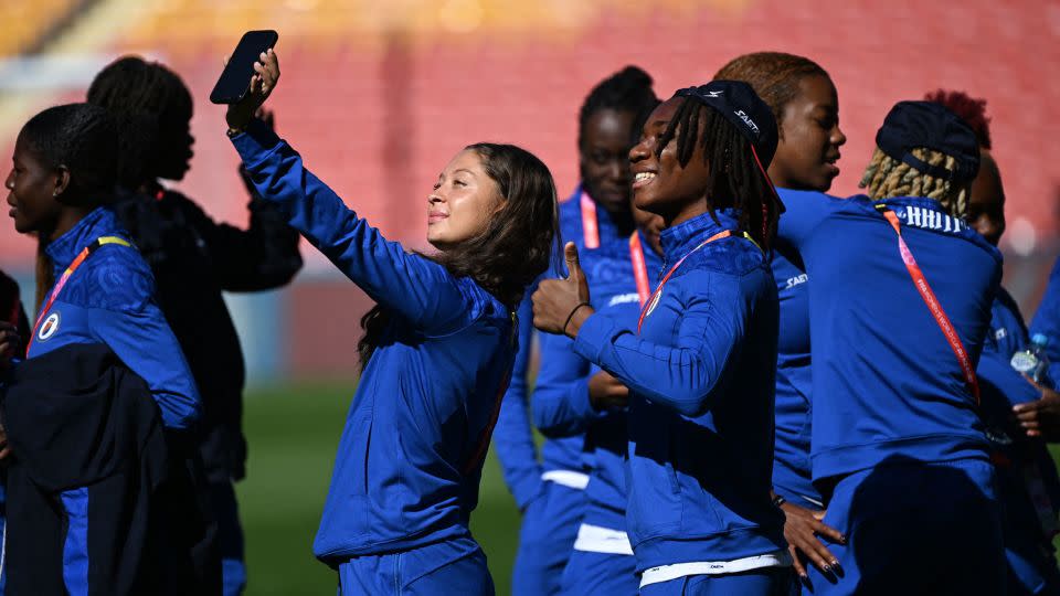 Haiti's Noa Ganthier holds a phone for a selfie in Brisbane Stadium, Australia, at the Women's World Cup on July 21, 2023. - Dan Peled/Reuters