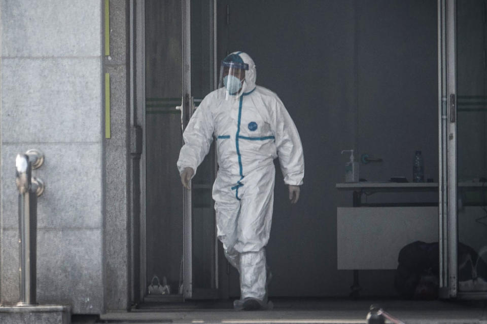 A medical staff member walks outside the Jinyintan hospital in Wuhan, China, on Jan. 18, 2020. | STR/AFP via Getty Images