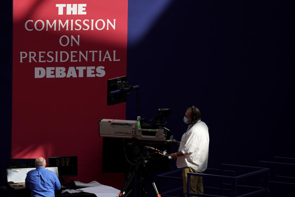 A camera operator waits for a rehearsal ahead of the first presidential debate between Republican candidate President Donald Trump and Democratic candidate former Vice President Joe Biden at the Health Education Campus of Case Western Reserve University, Monday, Sept. 28, 2020, in Cleveland. (AP Photo/Julio Cortez)