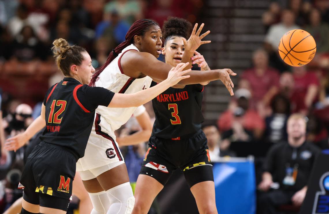 South Carolina Gamecocks forward Aliyah Boston (4) is guided by guard Elisa Pinzan (12) and guard Lavender Briggs (3) of Maryland during the Elite 8 round of the 2023 NCAA Tournament at Bon Secours Wellness Arena in Greenville on Monday, March 27, 2023.
