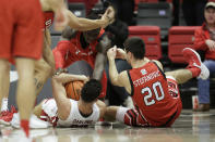 Utah center Keba Keita, top, guard Lazar Stefanovic, right, and Washington State guard Dylan Darling go after the ball during overtime of an NCAA college basketball game, Sunday, Dec. 4, 2022, in Pullman, Wash. Utah won 67-65. (AP Photo/Young Kwak)