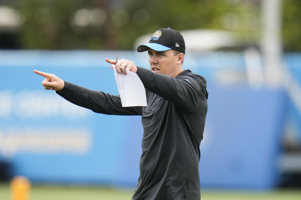 Los Angeles Chargers offensive coordinator Kellen Moore points to his players during the NFL football team's camp Wednesday, May 31, 2023, in Costa Mesa, Calif. (AP Photo/Jae C. Hong)