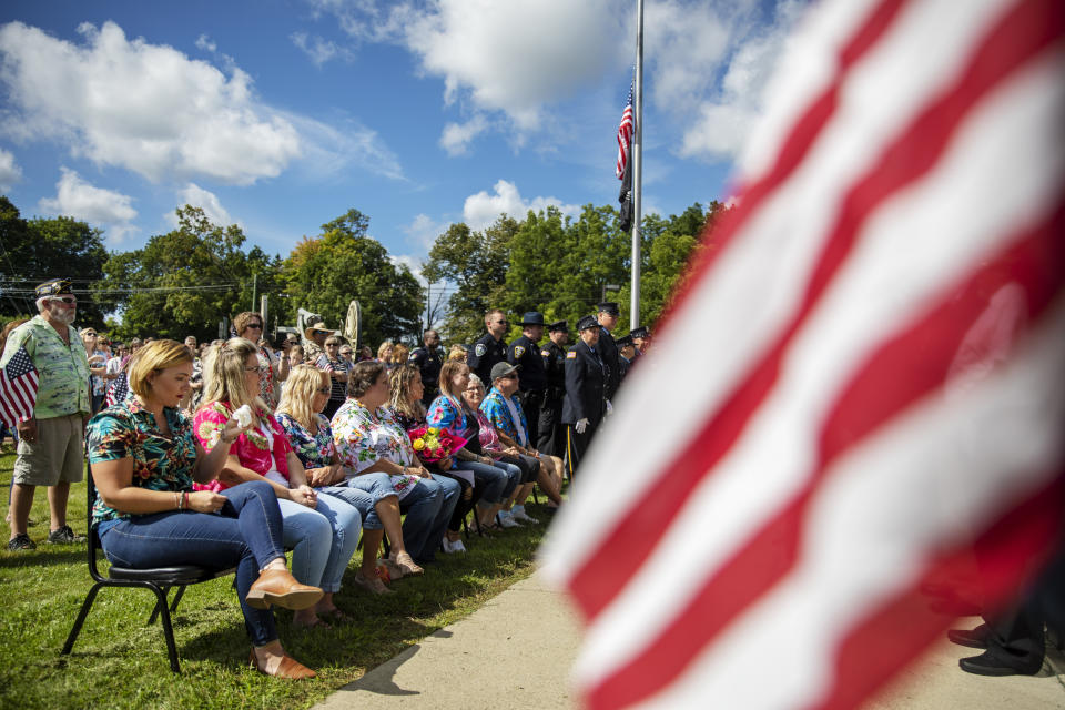 Friends and family of Sgt. James Johnston, who was killed in Afghanistan in June, wear Hawaiian shirts in his honor at a memorial service in Trumansburg, N.Y., Saturday, Aug. 31, 2019. Johnston was the loyal friend, the comic relief, the Hawaiian shirt aficionado and now, he was Trumansburg's contribution to the list of some 2,300 American dead in the war in Afghanistan. (AP Photo/David Goldman)