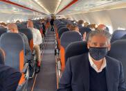 EasyJet CEO Johan Lundgren and other passengers are pictured during a flight to new Berlin-Brandenburg Airport (BER)