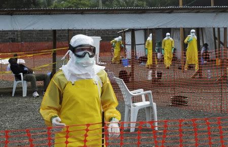 Medicins Sans Frontieres (MSF) health workers prepare at ELWA's isolation camp during the visit of Senior United Nations (U.N.) System Coordinator for Ebola David Nabarro, at the camp in Monrovia August 23, 2014. REUTERS/2Tango