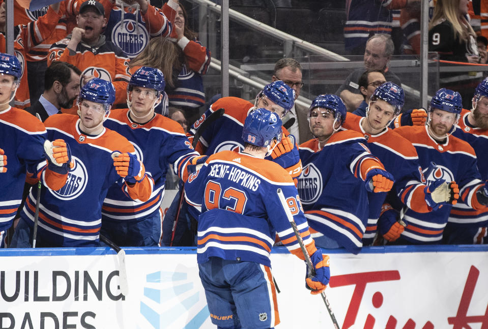 Edmonton Oilers' Ryan Nugent-Hopkins (93) celebrates a goal against the Arizona Coyotes during the second period of an NHL hockey game in Edmonton, Alberta, Wednesday, March 22, 2023. (Jason Franson/The Canadian Press via AP)