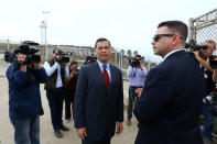 Attorney General of California Xavier Becerra walks along the U.S.-Mexico border at the Pacific Ocean after announcing a lawsuit against the Trump Administration over its plans to begin construction of border wall in San Diego and Imperial Counties, in San Diego, California, U.S., September 20, 2017. REUTERS/Mike Blake
