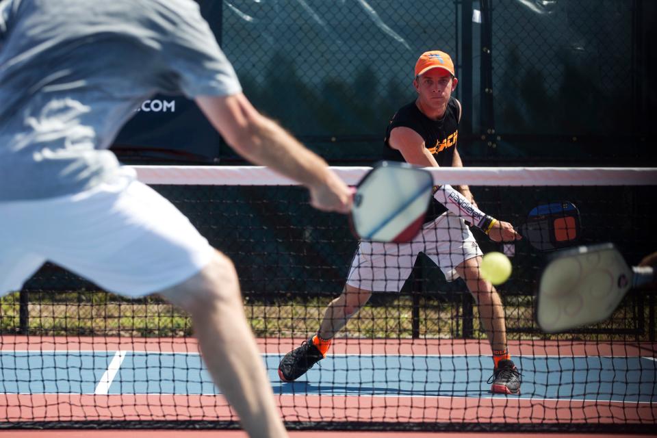 Kyle Yates hits the ball during the mixed doubles 19 and over championship match during the US Open Pickleball Championships at East Naples Community Park on April 28, 2016.