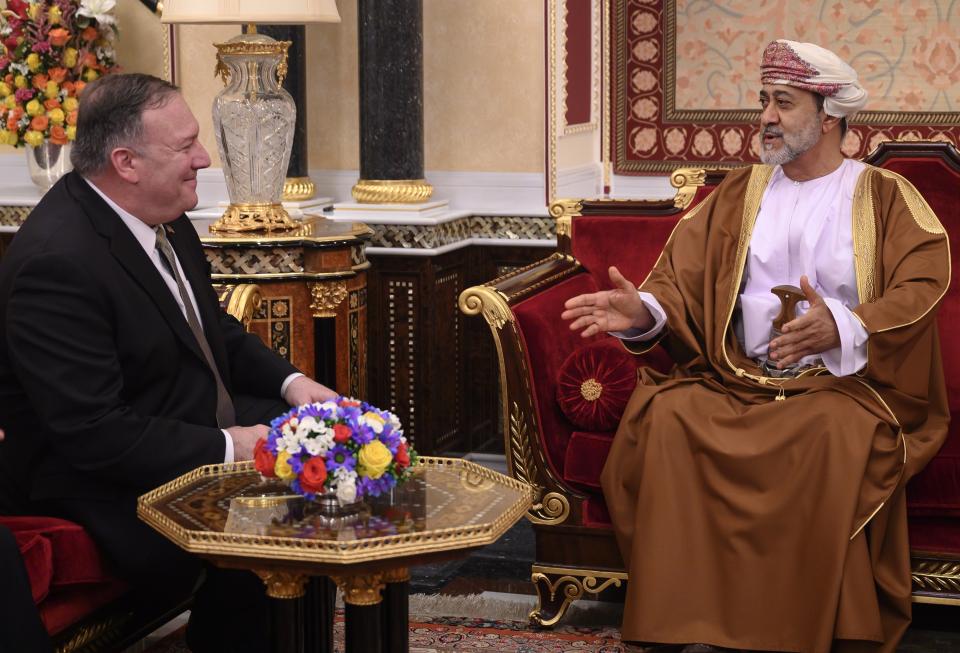 FILE - In this Feb. 21, 2020 file photo, Oman's Sultan Haitham bin Tariq meets with US Secretary of State Mike Pompeo, left, at al-Alam palace in the capital Muscat, Oman. The new sultan, while quietly making his mark, faces real challenges ahead. Oman has billions in looming loan repayments, including from China, and needs even more money as its youthful population wants jobs and its government cannot afford the cradle-to-grave benefits given in other Gulf Arab nations. (Andrew Caballero-Reynolds/Pool via AP, File)