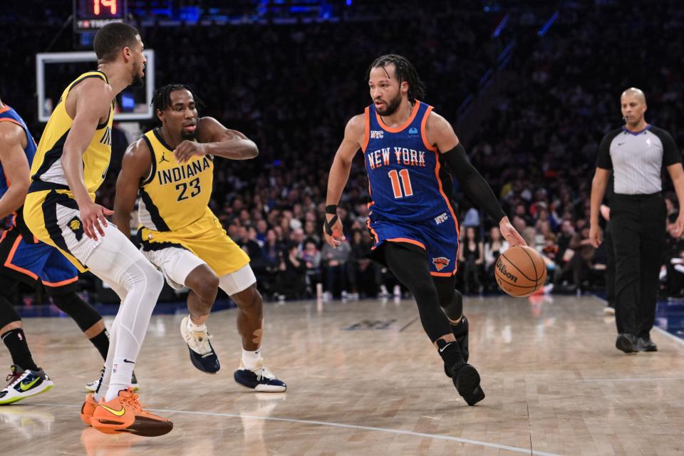 Feb 10, 2024; New York, New York, USA; New York Knicks guard Jalen Brunson (11) dribbles while being defended by Indiana Pacers forward Aaron Nesmith (23) and Indiana Pacers guard Tyrese Haliburton (0) during the third quarter at Madison Square Garden. Mandatory Credit: John Jones-USA TODAY Sports