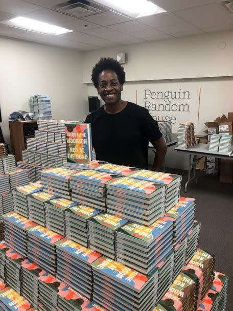 PHOTO: Author Jacqueline Woodson poses with her book, 'Red at the Bone,' which was challenged in various states across the U.S. amid a spike in book bans. (Courtesy Jacqueline Woodson)