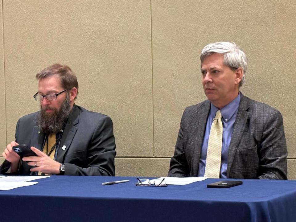 Deputy Kansas Secretary of State Clay Barker, right, during a meeting of the state Board of Canvassers.