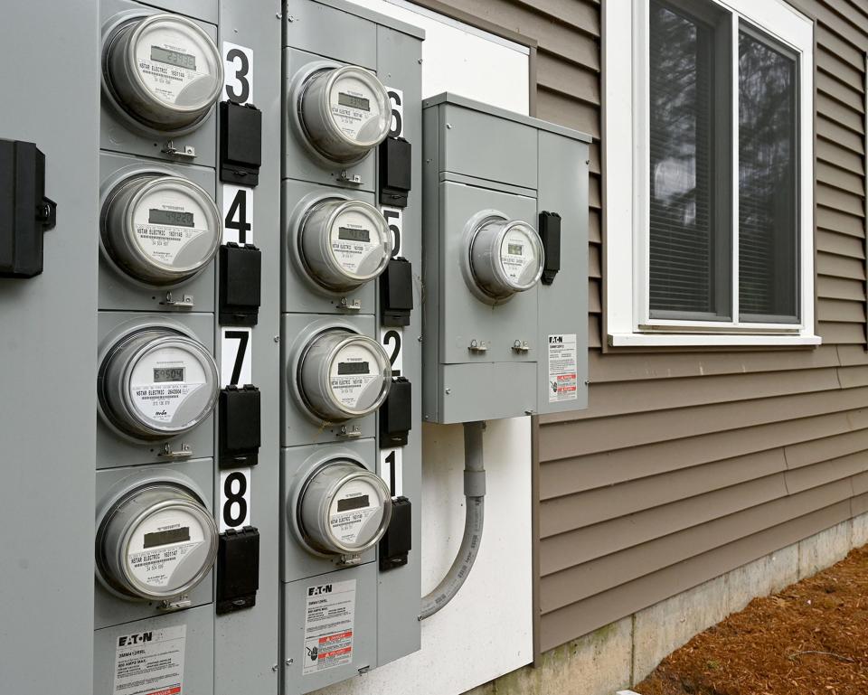 A bank of NSTAR electric meters at a Natick, MA condominium complex, May 17, 2022.