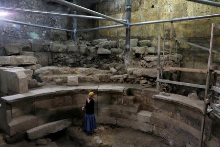 Israel Antiquities Authority archaeologist Tehillah Lieberman stands inside a theatre-like structure during a media tour to reveal the structure which was discovered during excavation works underneath Wilson's Arch in the Western Wall tunnels in Jerusalem's Old City October 16, 2017. REUTERS/Ronen Zvulun