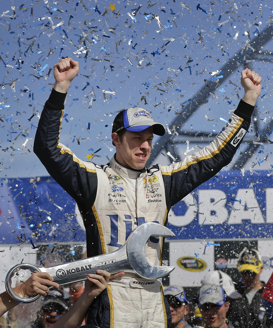 Brad Keselowski celebrates after winning a NASCAR Sprint Cup Series auto race on Sunday, March 9, 2014, in Las Vegas. Keselowski overtook Dale Earnhardt Jr. on the last lap when Earnhardt ran out of fuel. (AP Photo/Julie Jacobson)