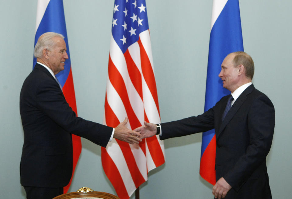 FILE - In this March 10, 2011, file photo, Vice President of the United States Joe Biden, left, shakes hands with Russian Prime Minister Vladimir Putin in Moscow, Russia. The Kremlin said Friday March 19, 2021, that President Vladimir Putin's offer for a quick call with U.S. President Joe Biden was intended to prevent bilateral ties from completely falling apart over Biden's description of the Russian leader as a killer. (AP Photo/Alexander Zemlianichenko, File)